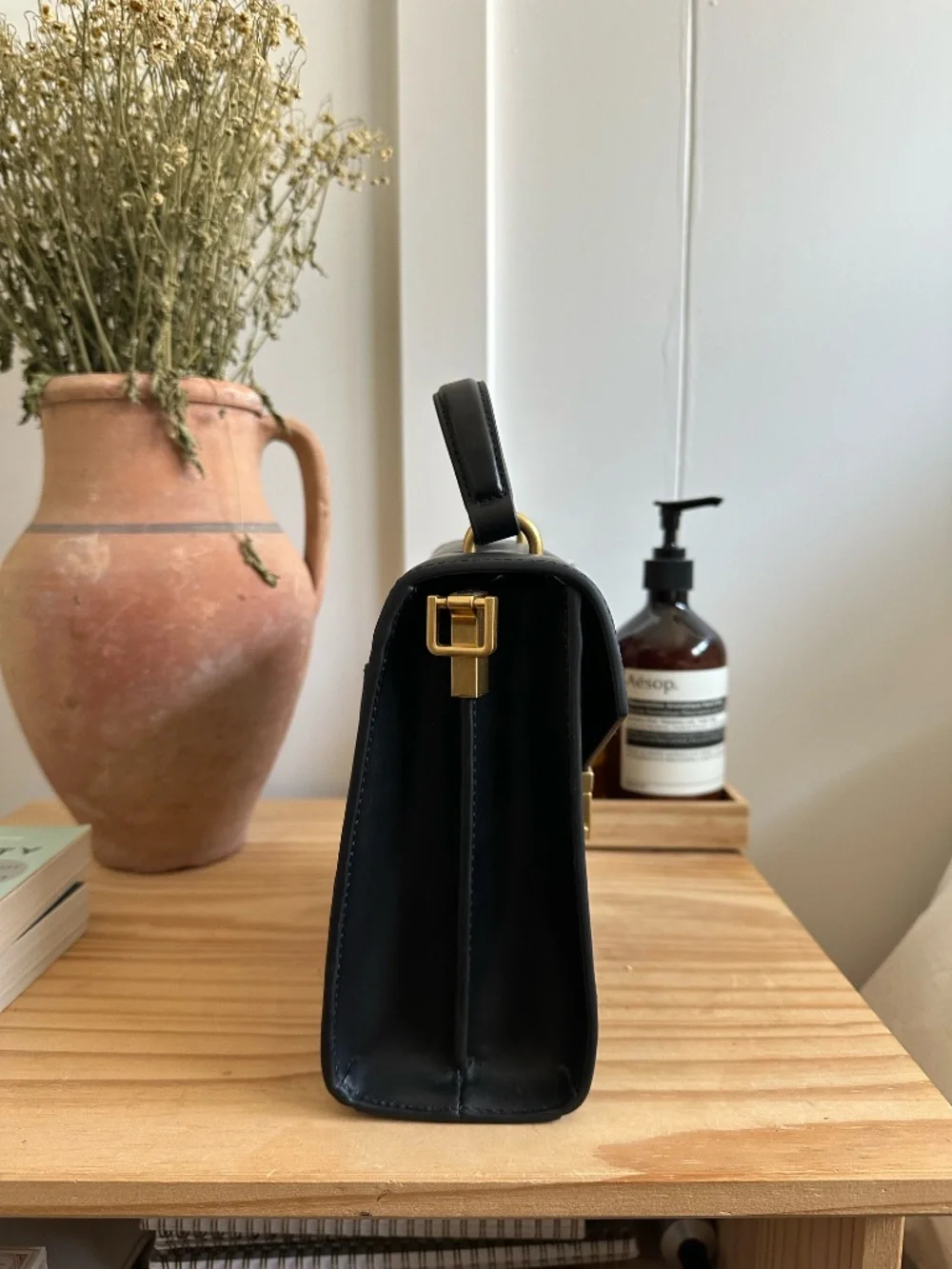 Quince black leather top-handle bag